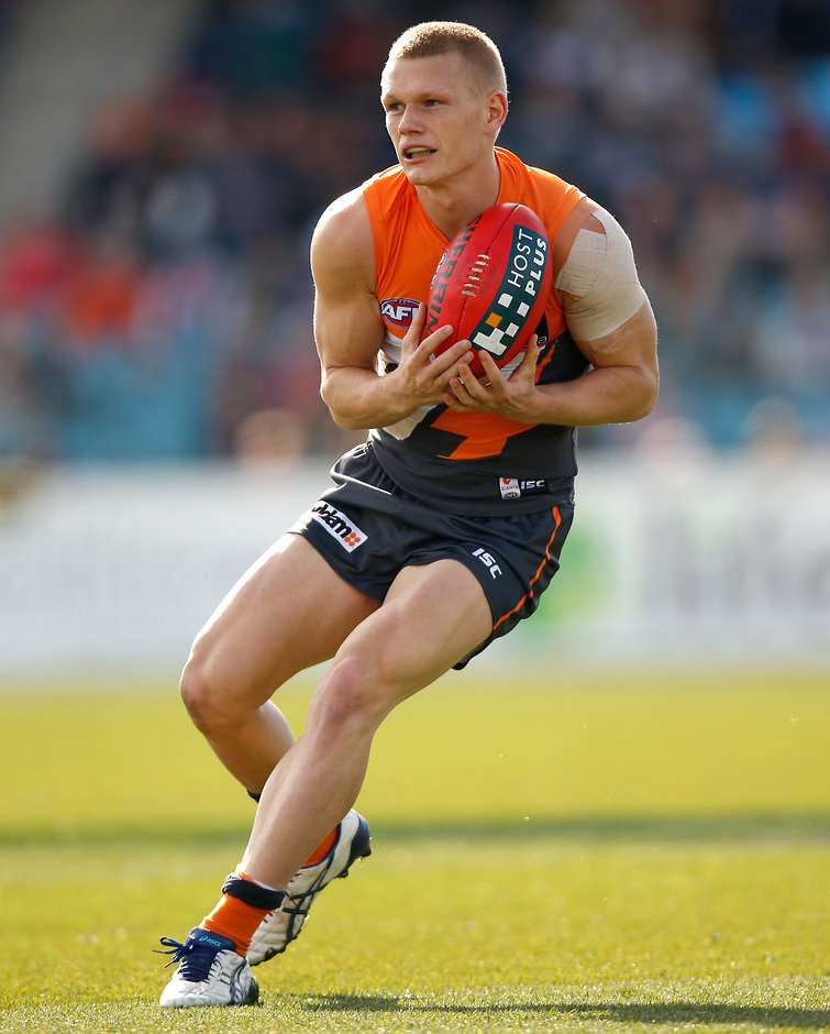 AFL 2014 Rd 20 - GWS Giants v North Melbourne Adam Treloar of the Giants in action during the 2014 AFL Round 20 match between the GWS Giants and the North Melbourne Kangaroos at StarTrack Oval, Canberra on August 09, 2014. (Photo: Michael Willson/AFL Media)